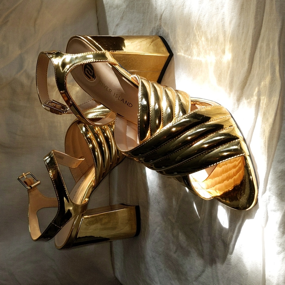 Shiny gold heels